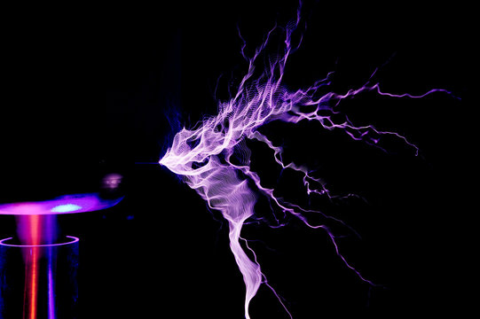 Tesla Coil, Electrostatic Discharge spark, lightning on black background 
