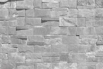 Foto op Plexiglas Stenen textuur muur Grijze stenen muur achtergrond naadloos