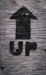 Outdoor wooden sign UP arrow with texture