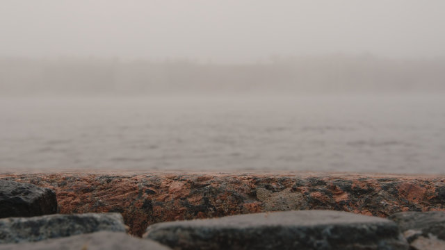 FOG: Close up of stones of an embankment of the Neva river - St. Petersburg, Russia