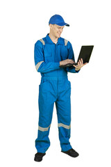 European male mechanic using a laptop on studio