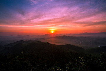 Fototapeta premium The sun is rising from the mountains, fresh morning. Colorful and memorable