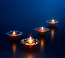 Fototapeta premium Colorful diya lamps lit during diwali celebration