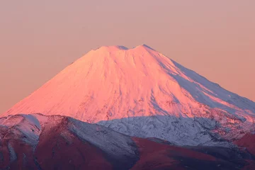 Poster Snow top of Mt. Ngauruhoe  volcano at sunset, Tongariro National Park, New Zealand © NMint
