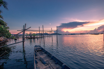 Fototapeta na wymiar Fishing boat and houseboat evening clouds on sunset,kok yor songkhla,Thailand