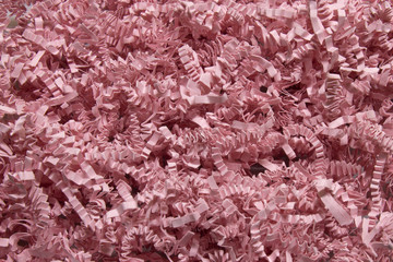 Pink shredded craft paper background