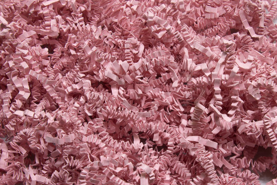 Pink shredded craft paper background