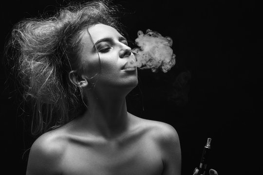 woman smoking electronic cigarette