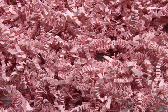 Pink shredded craft paper background