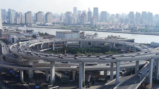 time lapse,Aerial freeway busy city rush hour heavy traffic jam highway Shanghai china,nanpu overpass interchange.