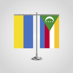 Table stand with flags of Ukraine and Comoros.Two flag. Flag pole. Symbolizing the cooperation between the two countries. Table flags