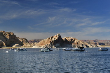 Fototapeta na wymiar USA. A lot of pleasure boats serve tourists showing the beauty of Lake Powell