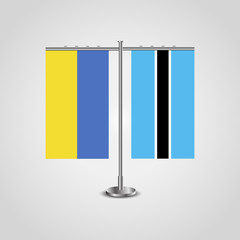 Table stand with flags of Ukraine and Botswana.Two flag. Flag pole. Symbolizing the cooperation between the two countries. Table flags