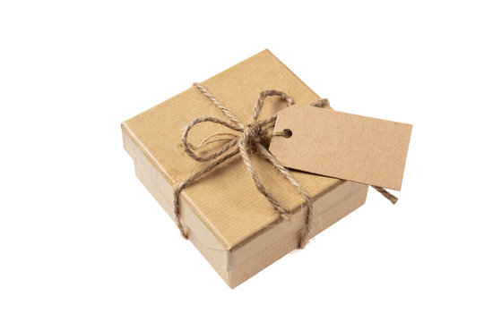 Beige isolated recycle gift box with tag on a white background