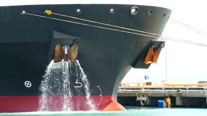 Large ship dump ballast  water at the port