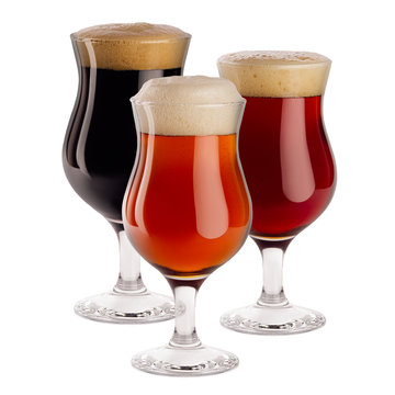 Different beer in wineglasses with foam - lager, red ale, porter -  isolated on white background.