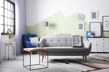 Beautiful living room interior with comfortable sofa