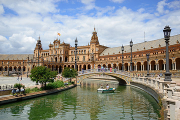 Obraz na płótnie Canvas Seville, Spain - May 25, 2018: Plaza de España with the building of the National Geographic Institute in the background.