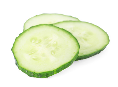 Slices of fresh cucumber on white background
