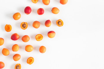 Apricots on white background. Flat lay, top view, copy space