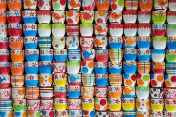 Fototapeta premium Colorful patterns of ceramic cups for the background.