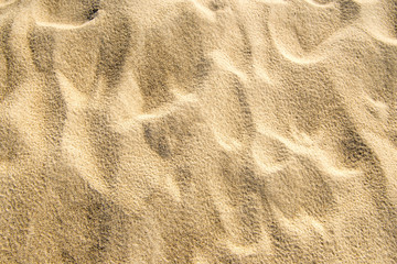 Sand of a beach with waves