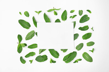 Flat lay composition with fresh green mint leaves on white background © New Africa