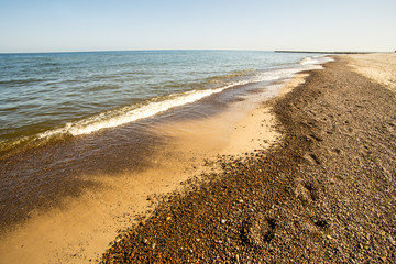 lonesome beach of the Baltic Sea with blue sky