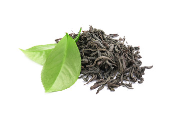 Dry and fresh tea leaves on white background