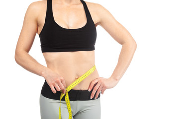 Healthy female body with measuring tape