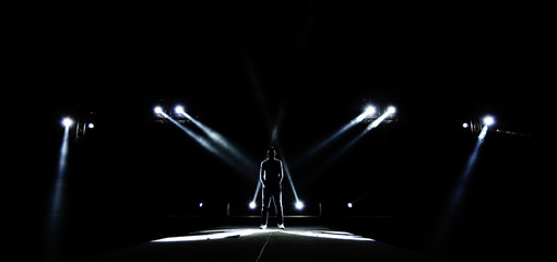 Silhouette of Male surround with Light, Dark Low Exposure, concept Unique Confidence