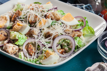 Healthy caesar salad with cheese, eggs and croutons