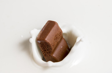 Chocolate falls in milk