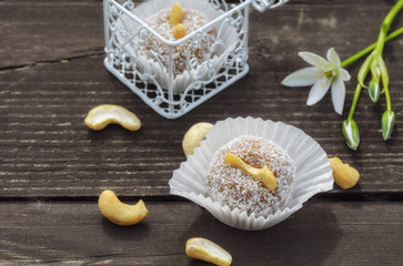 Delicious raw balls with cashew nuts, dates and coconut . No-bake, vegan dessert perfect for clean eaters. Healthy sweets and raw food diet concept