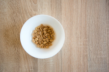 Peanut in white bowl