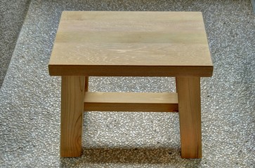 A wooden stool at  Japanese onsen room