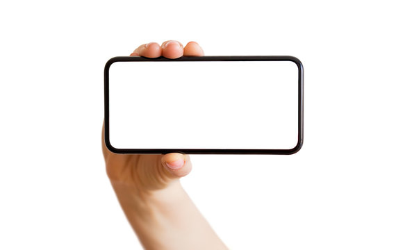 Person holding phone with empty white screen horizontally. Mobile app mockup.
