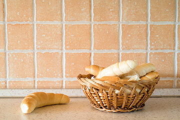 Fresh bakery in basket on table