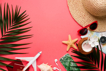 Traveler accessories on trendy pink background. Bright summer color. Top view.