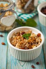 Traditional, mexican baked sweet rice, with almonds, raisins and walnuts.