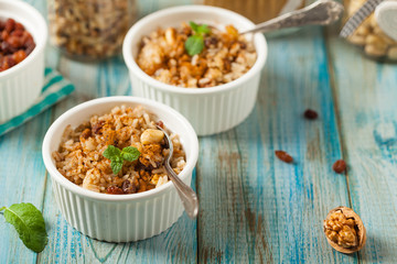 Traditional, mexican baked sweet rice, with almonds, raisins and walnuts.