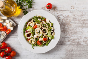 Salad with squid rings.