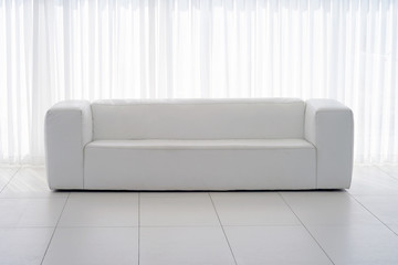 Interior of the living room of the hotel. Beautiful living room with white sofa. White Concept Living Room Interior. Modern bed room interior in Luxury villa. White colours, big window