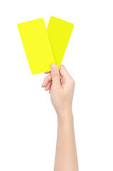 Hand showing two yellow card isolated on white background with clipping path. Abstract sign and symbol for soccer sport.