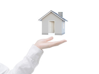 Fototapeta na wymiar Female hand showing 3D house isolated on white background with clipping path. Image idea of real estate and property concept. House 3D render.