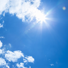 Fototapeta na wymiar Sun rays and blue sky