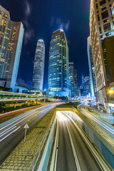 Fototapeta premium traffic light stream and highrise bulidings in Hongkong city，china