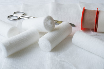 Medical bandages with scissors and sticking plaster. Medical equipment.