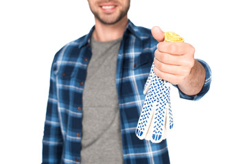 cropped shot of man holding protective gloves isolated on white background