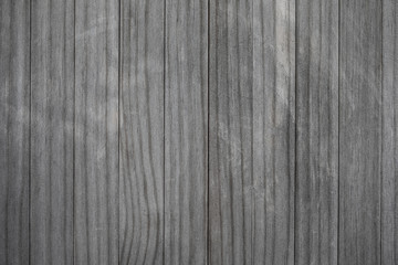 Blank wood pattern wall with grain and scratches. Weathered wood rustic background. Grey brown color Old rough timber..